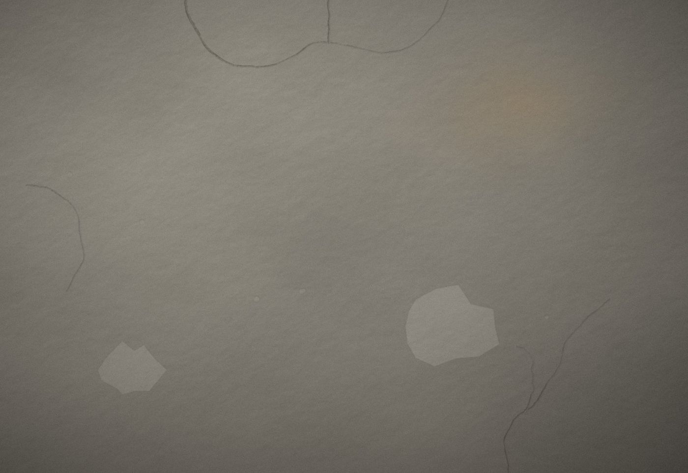 Aged wall with hairline cracks, staining and old patch work before repair
